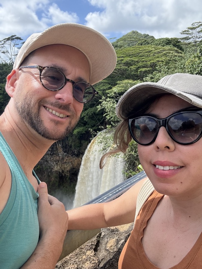 Irma and her husband at a waterfall lookout